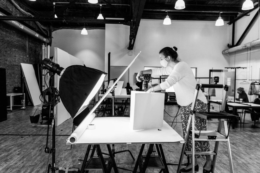 Photographer shooting a table top set at The Line Studios