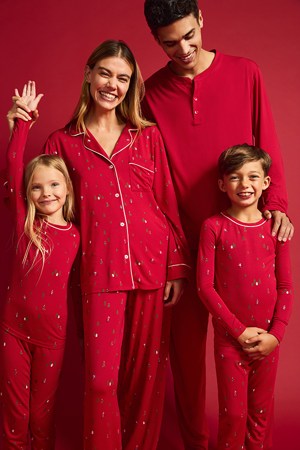 Color enhanced editorial image of a family in red pajamas after retouching