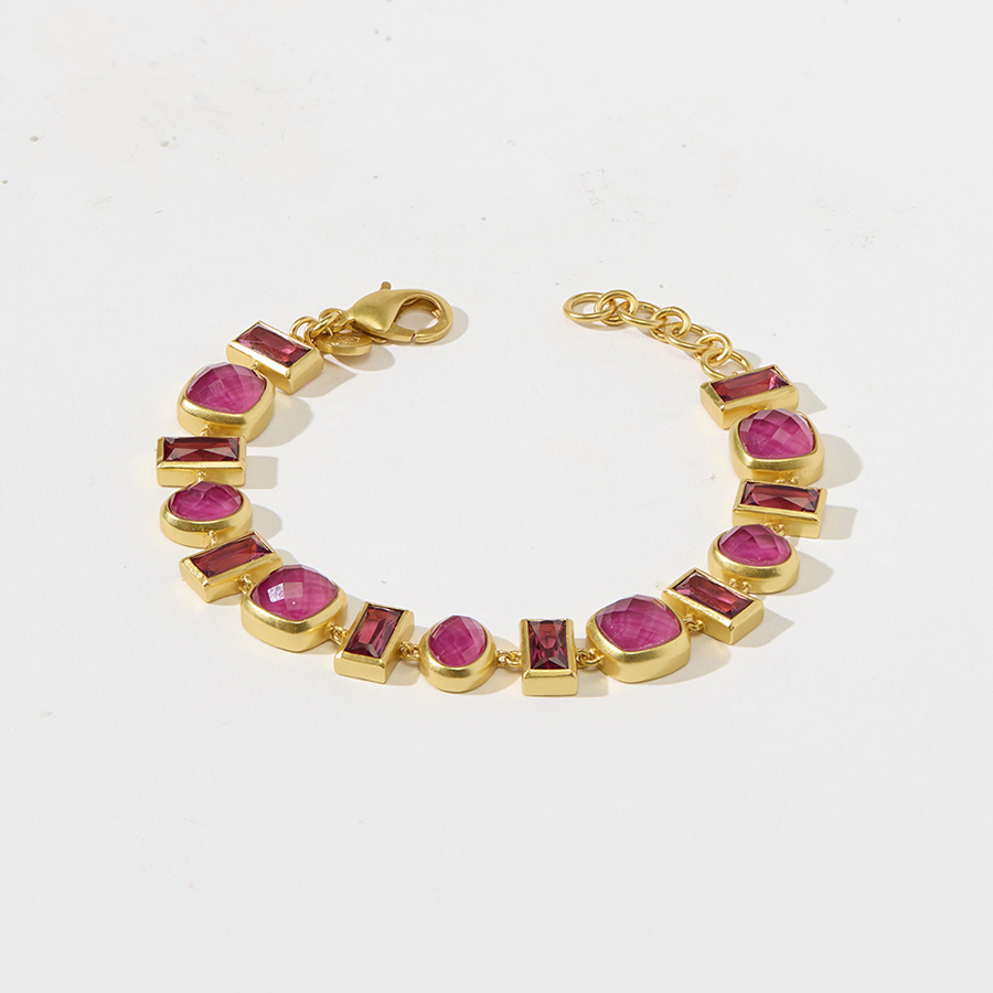 Jewelry product image of a gold bracelet with pink gems before retouch