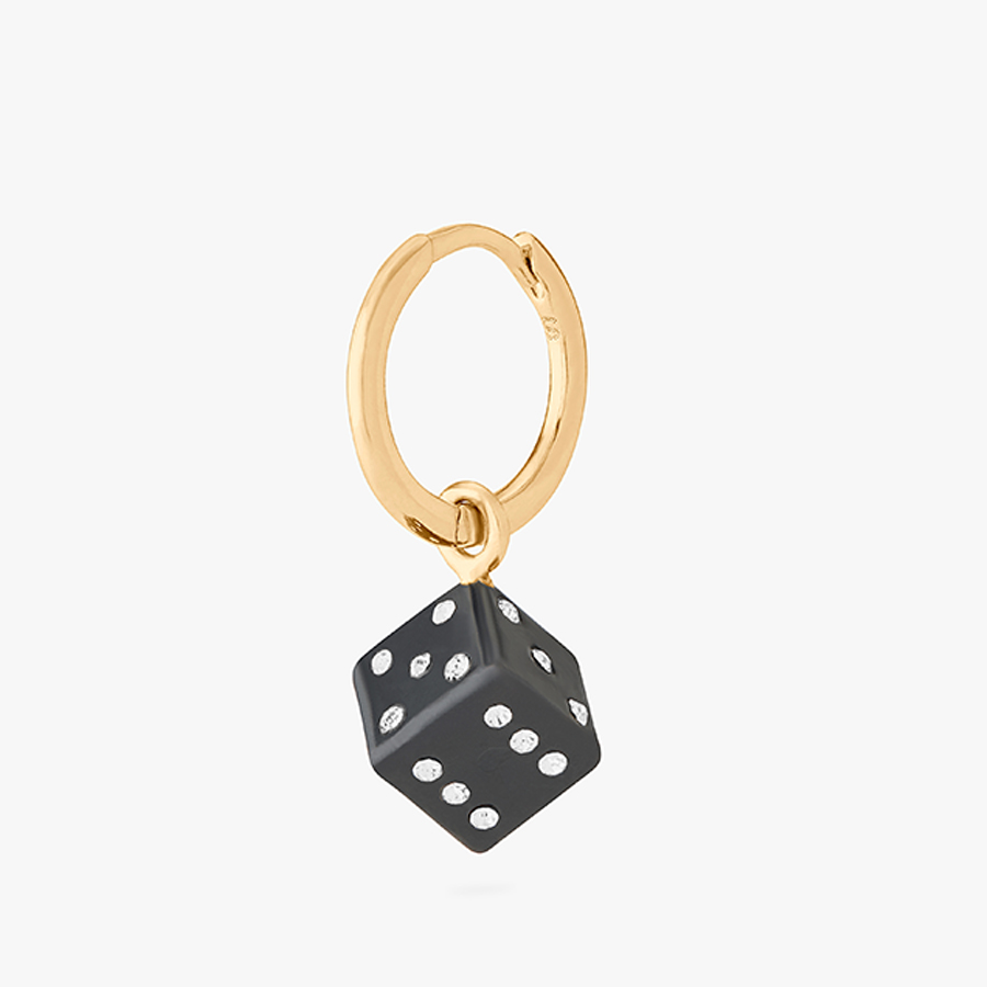 Jewelry product image of a gold hoop earring with a black dice charm, after retouching, with color correction and no props