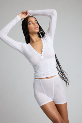 Model in white Negative Underwear loungewear, versatile image for product pages, social, and emails, showcasing product details.